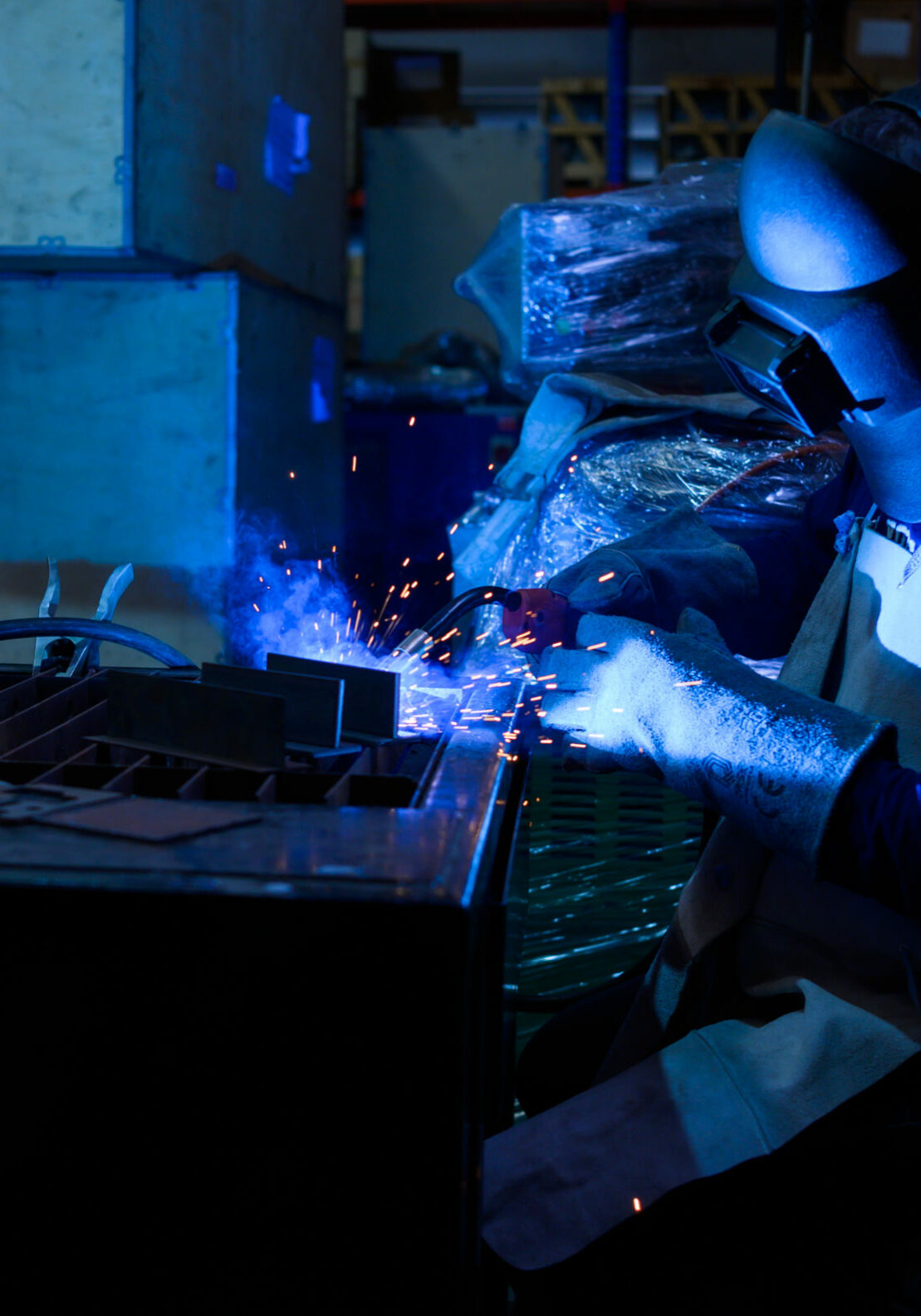 A welder is working to weld metal. to create quality work according to the prescribed form